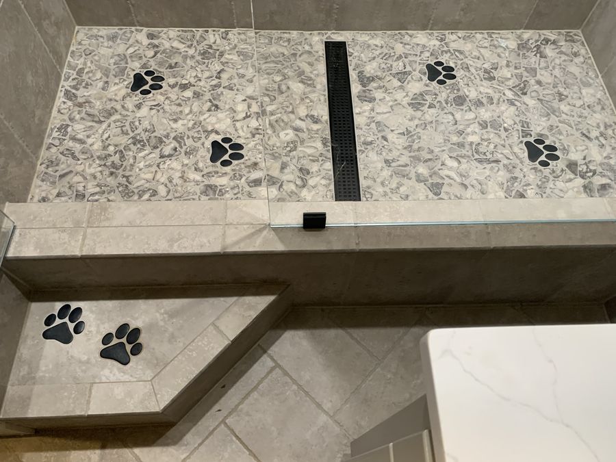 Overhead view of dog wash pan, bench and step with paw prints