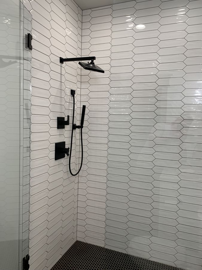 Large black hexagon floor tile with white grout